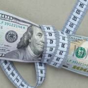 dollars with measuring tape