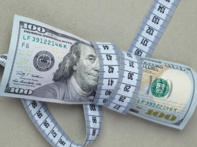 dollars with measuring tape