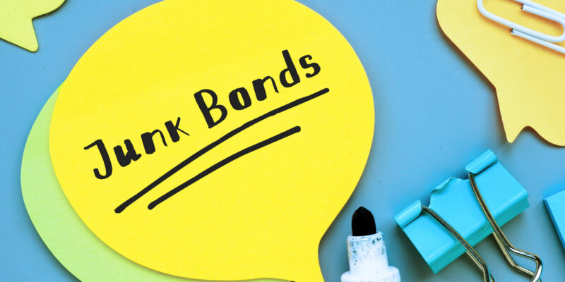 Business concept about Junk Bonds with sign on the sheet.