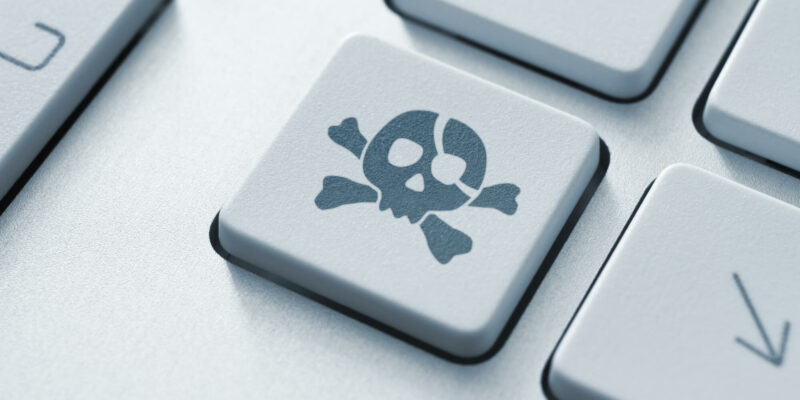 Piracy attack button on the keyboard. Toned Image.