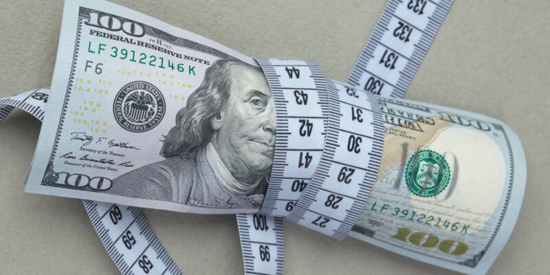 100 dollarы is wrapped in centimeter tape