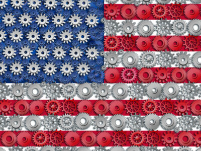 American economy symbol represented by gears and cogs in the shape and color of the flag of the U.S.A. showing industry business and manufacturing working toget