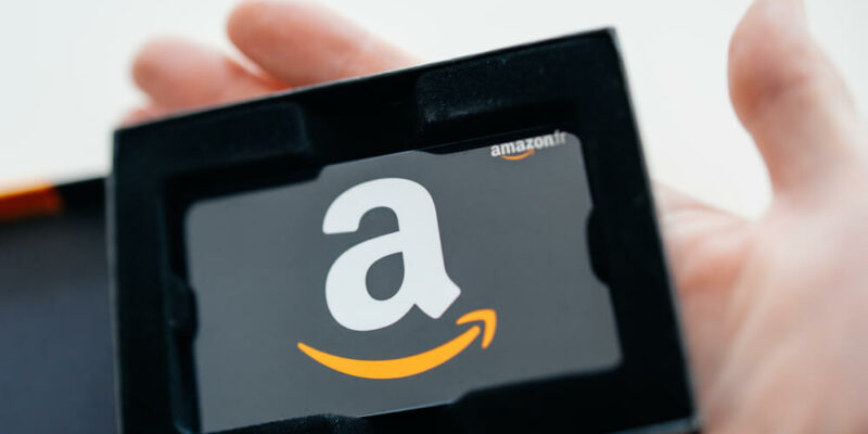 Close-up of Amazon Gift Card in beautiful box ready to be offered as a gift. Amazon Gift Box