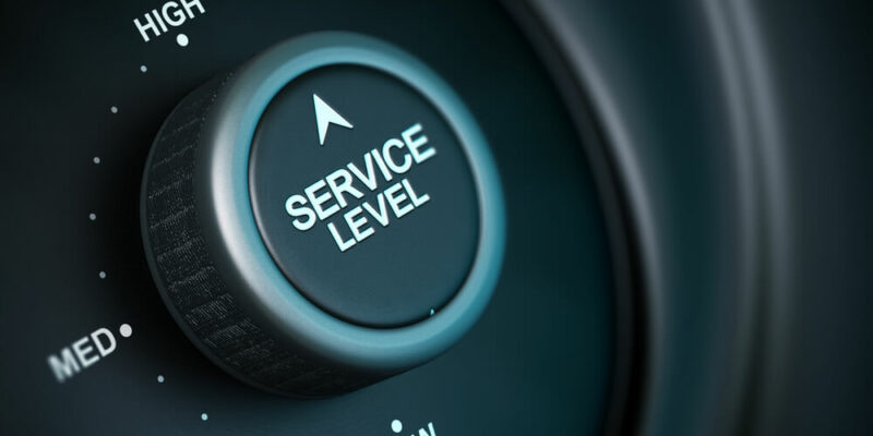 service level button with low, medium and high positions, button is positioned in the highest position, black and blue background, blur effect