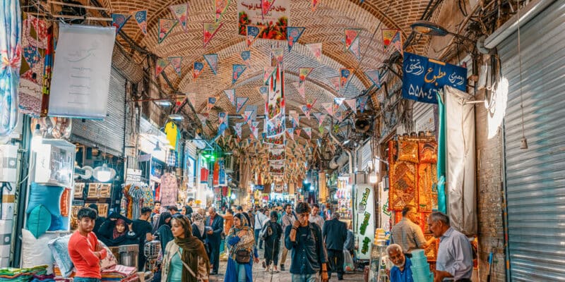 Iranian people shopping in Tehran Grand Bazaar which is an old historical bazaar in Tehran still used today as a centre of economic activity