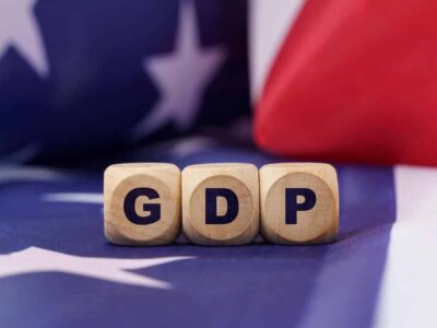 American economy and business concept. The US flag has cubes with the inscription - GDP