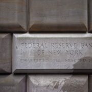 Sign table of the Federal Reserve Bank of New York, USA. The New York Fed implements monetary policy, supervises and regulates financial institutions and helps maintain the nations payment systems