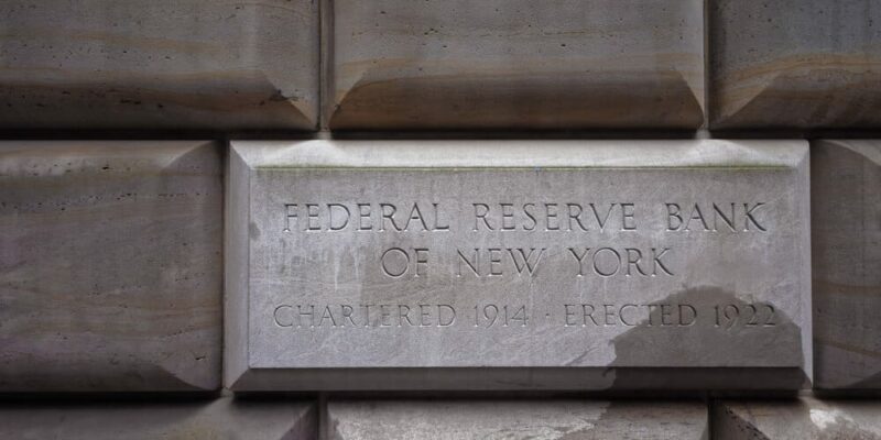 Sign table of the Federal Reserve Bank of New York, USA. The New York Fed implements monetary policy, supervises and regulates financial institutions and helps maintain the nations payment systems