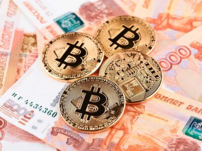 Coin Bitcoin against the background of Russian rubles