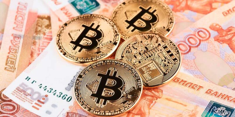 Coin Bitcoin against the background of Russian rubles