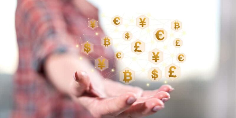 Currency exchange concept above the hand of a woman in background