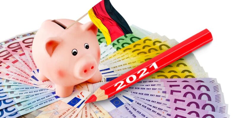 Euro with piggy bank and German flag 2021