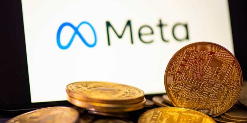 Metaverse coin crypto currency blockchain concept, META on smartphone screen with gold coin on meta logo background.