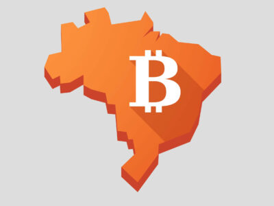 Illustration of an orange Brazil map with a bitcoin sign