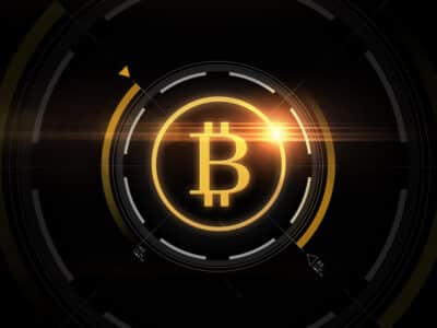 cryptocurrency, finance and business concept - gold bitcoin projection over black background