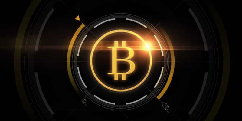 cryptocurrency, finance and business concept - gold bitcoin projection over black background