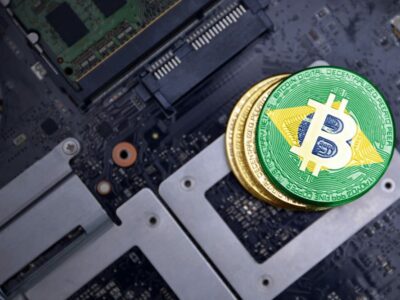 golden shining bitcoins with flag of brazil on a computer electronic circuit board. bitcoin mining concept.