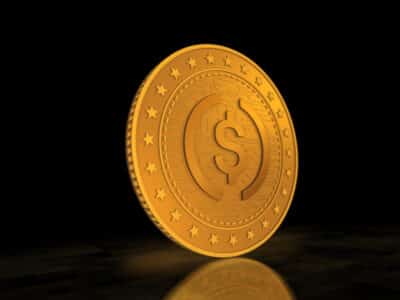 USDC cryptocurrency symbol gold USD coin on green screen background. Abstract concept.