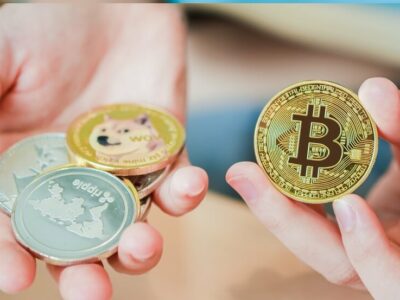 Woman's hand holding cryptocurrencies or Bitcoin. Concept of blockchain system crisis.