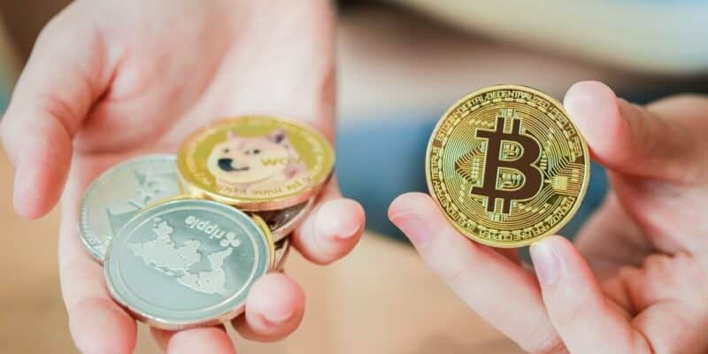 Woman's hand holding cryptocurrencies or Bitcoin. Concept of blockchain system crisis.