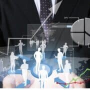 businessman with financial symbols coming from hand