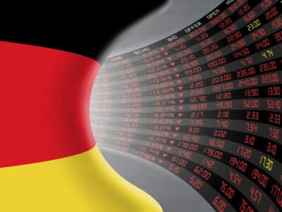 National flag of Germany with a large display of daily stock market price and quotations during economic recession period. The fate and mystery of German stock market, tunnel/corridor concept.