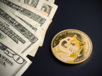 Dogecoin and dollars on black background