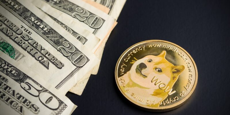 Dogecoin and dollars on black background
