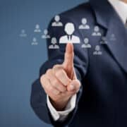 Human resources officer choose employee standing out of the crowd. Select team leader concept. Gender discrimination in employees selection.