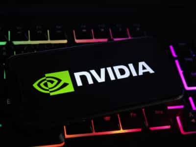 Viersen, Germany - May 1. 2021: Closeup of mobile phone screen with logo lettering of nvidia corporation on computer keyboard