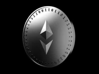 Silver coin with the symbol of the digital crypto currency Ethereum and binary code, isolate on a black background, 3D rendering