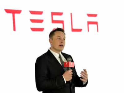 Tesla CEO Elon Musk speaks during a press conference for Tesla Firmware 7.0