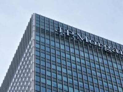 London, United Kingdom - February 03, 2019: Sun shines on J P Morgan signage at top of their UK branch at Canary Wharf.